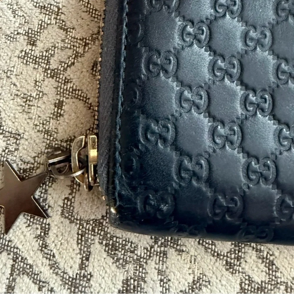 Gucci Black GG Embossed Zip-Around Coin Wallet with Star Charm